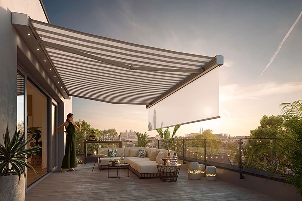 A spacious terrace with a large awning casting shadows, greenery in planters, and a comfortable seating area. A spacious terrace with a large awning casting shadows, greenery in planters, and a comfortable seating area.