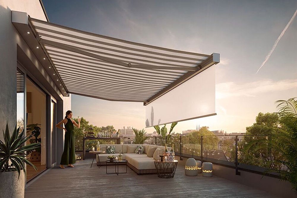A spacious terrace with a large awning casting shadows, greenery in planters, and a comfortable seating area. A spacious terrace with a large awning casting shadows, greenery in planters, and a comfortable seating area.