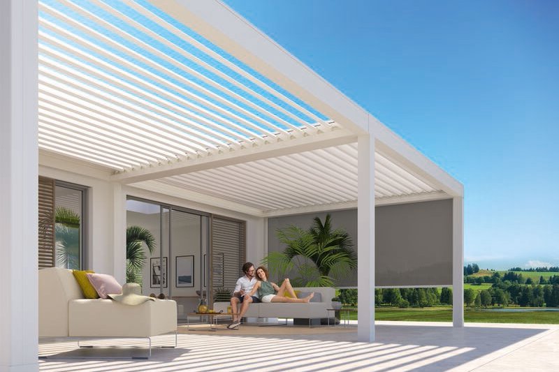 A modern outdoor space featuring a sleek structure with horizontal slats and a patio area. Bright sunlight and greenery. A modern outdoor space featuring a sleek structure with horizontal slats and a patio area. Bright sunlight and greenery.