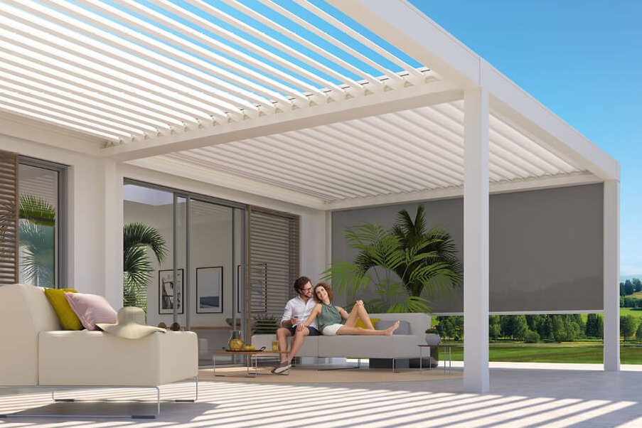 A modern outdoor space featuring a white overhanging structure with striped shading and seating area. A modern outdoor space featuring a white overhanging structure with striped shading and seating area.