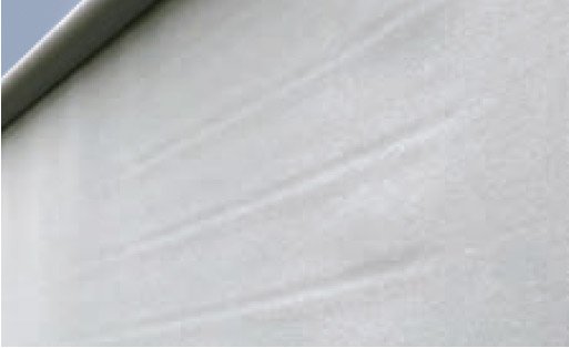 Close-up of a light grey fabric, possibly a awning fabric, displaying smooth textures and subtle folds. Close-up of a light grey fabric, possibly a awning fabric, displaying smooth textures and subtle folds.