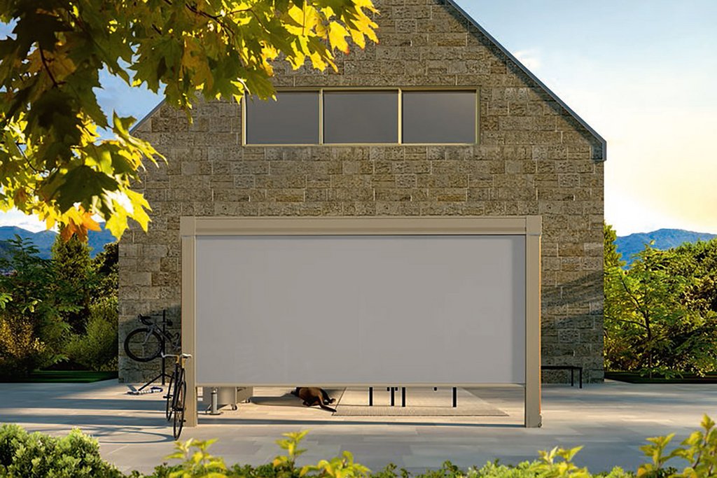 A modern building with a flat-roofed extension, featuring a white panel and surrounded by greenery. A modern building with a flat-roofed extension, featuring a white panel and surrounded by greenery.