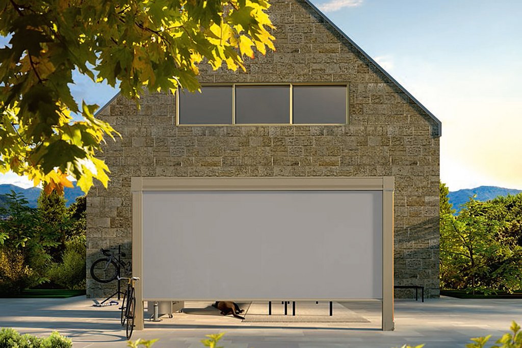 A modern building with a flat-roofed extension, featuring a white panel and surrounded by greenery. A modern building with a flat-roofed extension, featuring a white panel and surrounded by greenery.