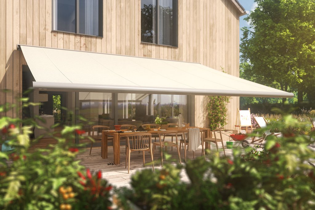 A beige awning covers a terrace with wooden furniture and vibrant plants in a sunny outdoor setting. A beige awning covers a terrace with wooden furniture and vibrant plants in a sunny outdoor setting.