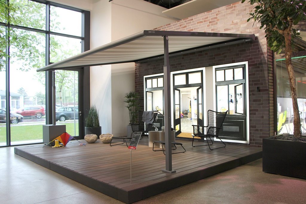 A modern outdoor space with a covering, featuring large windows and a wooden deck. A modern outdoor space with a covering, featuring large windows and a wooden deck.